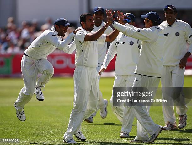 Zaheer Khan of India celebrates the wicket of Alastair Cook of England with team mates during day four of the Second Test match between England and...