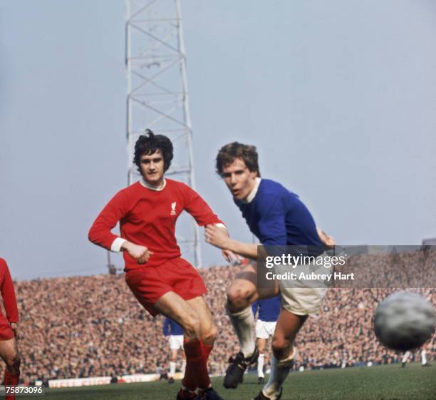 Liverpool defender Larry Lloyd and Everton centre-forward Joe Royle in action during an FA Cup semi-final match against Everton at Old Trafford,...