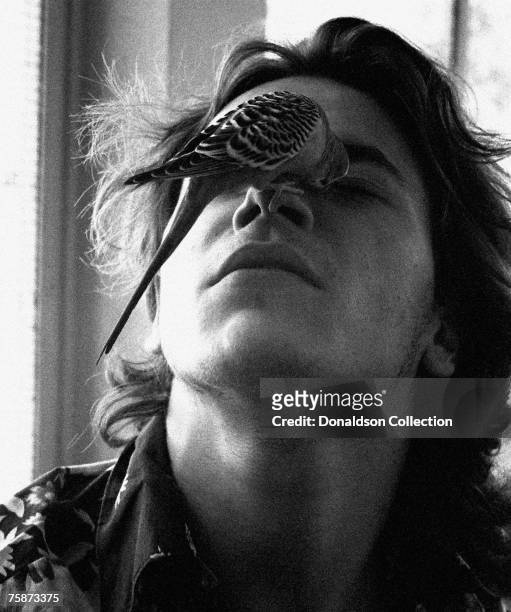 Actor River Phoenix poses for a photo shoot with a bird at his residence in Florida, USA.