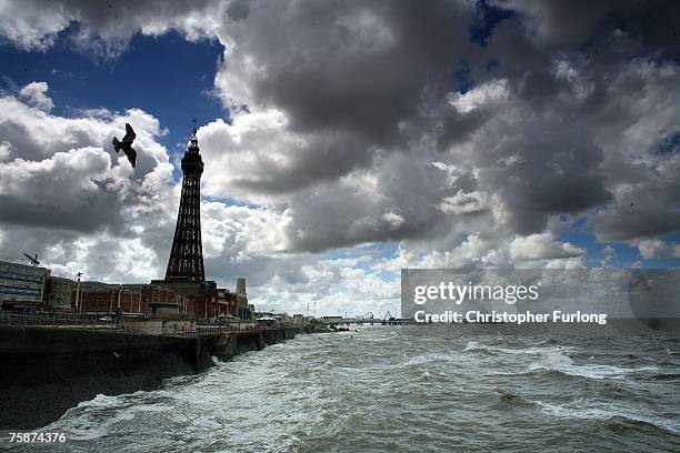 Waves whipped up by the wind hit the shore as holiday makers arrive for the the warm but windy weather on July 30 Blackpool, England. After the...