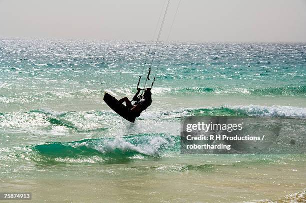 kite surfing at santa maria on the island of sal (salt), cape verde islands, atlantic ocean, africa - sal stock pictures, royalty-free photos & images