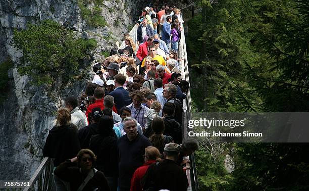 The Marien bridge, a picturesque spot near the castle Neuschwanstein is crowded by tourists on July 30, 2007 in Schwangau, Germany. During the German...