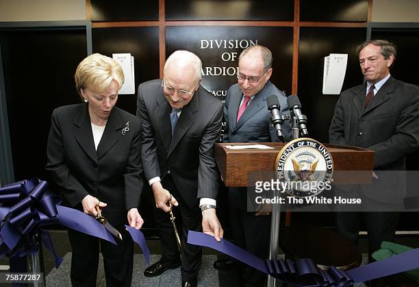 In this White House handout photo, Vice President Dick Cheney and his wife Lynne Cheney cut the ceremonial ribbon opening the Richard B. And Lynne V....