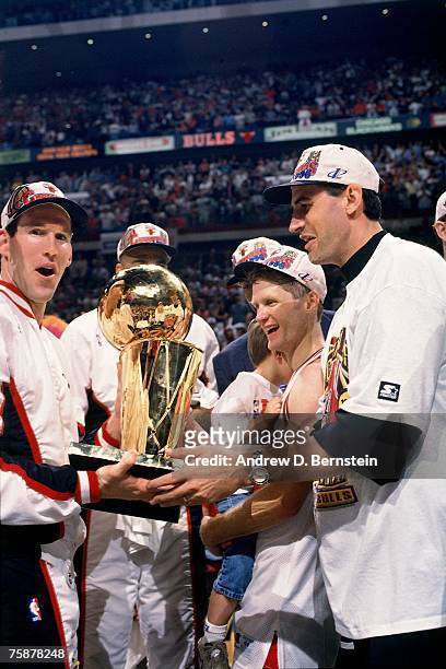 Jud Buechler, Steve Kerr, and Jack Haley of the Chicago Bulls celebrate winning the1996 NBA Championship after defeating the Seattle SupperSonics in...