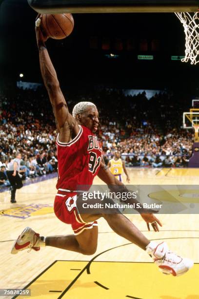 Dennis Rodman of the Chicago Bulls attempts a dunk against the Los Angeles Lakers during a 1996 NBA game at the Great Western Forum in Los Angeles,...