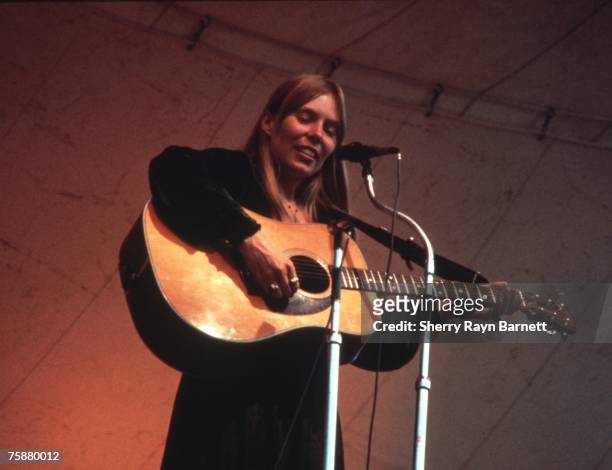 Singer songwriter Joni Mitchell performs at the Central Park Music Festival in New York, New York in 1969.