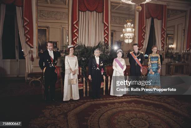 Emperor Hirohito of Japan pictured with King Baudouin of Belgium and other members of the Belgian royal family at a state dinner in Brussels, Belgium...