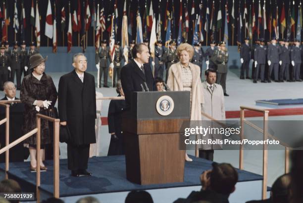 President of the United States Richard Nixon pictured speaking at a lectern as he welcomes Emperor Hirohito of Japan and Empress Nagako during a stop...