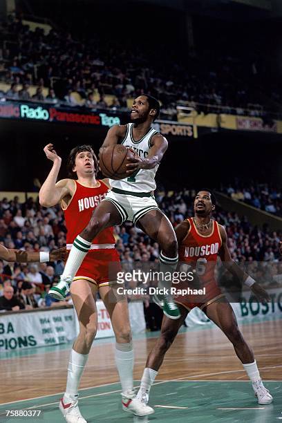 Nate Archibald of the Boston Celtics drives to the basket against the Houston Rockets during an NBA game circa 1978-1983 at the Boston Garden in...