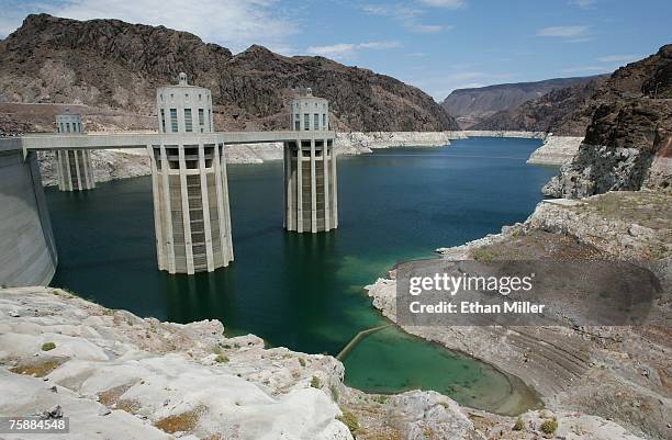 The Arizona Intake Towers at the Hoover Dam July 30, 2007 in the Lake Mead National Recreation Area, Arizona. The white "bathtub ring" on the rocks...