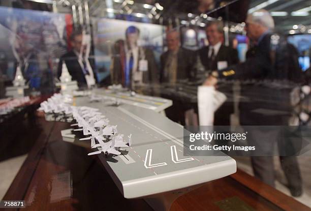 The CVN-77 future aircraft carrier concept is displayed at the Navy League's Sea Air Space Exposition March 26, 2002 in Washington, DC. The...