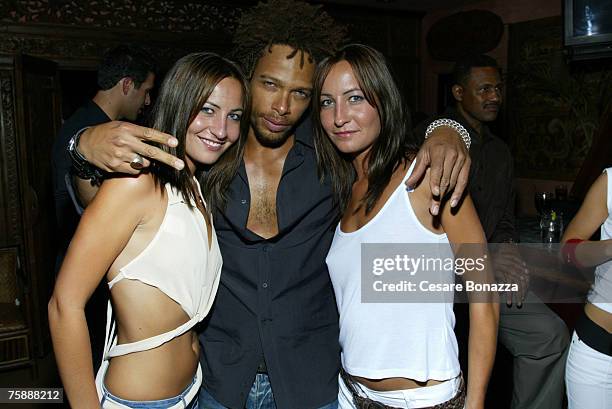 Gary Dourdan with twins Nikki Collins and Teena Collins at AAAW Party