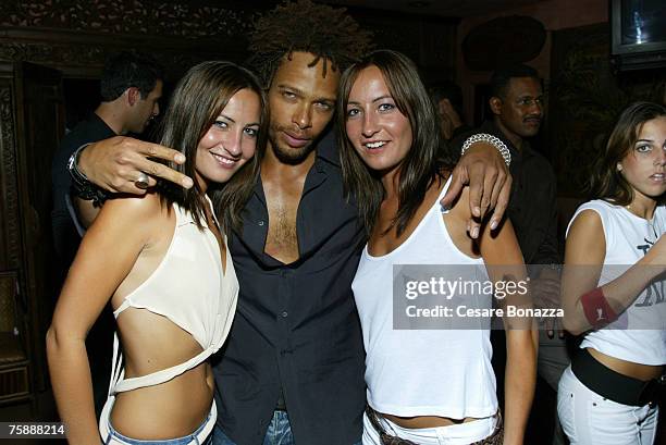 Gary Dourdan with twins Nikki Collins and Teena Collins at AAAW Party