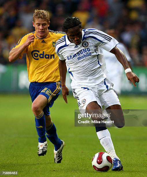 Didier Drogba of Chelsea gets away from Marten Rasmussen of Brondby during the pre-season friendly between Brondby and Chelsea at the Brondby Stadium...