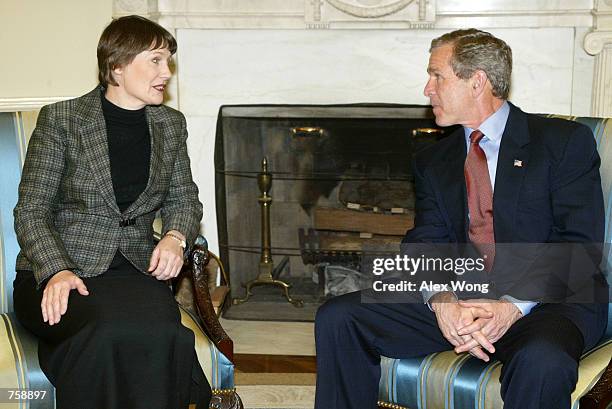 President George W. Bush speaks with New Zealand Prime Minister Helen Clark March 26, 2002 during their meeting at the Oval Office of the White House...