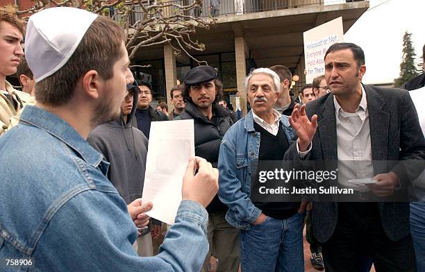 Pro-Palestinian demonstrator Amin Miraftab argues with pro-Israeli demonstrator Alexander Bilinskey April 9, 2002 during a protest on the University...