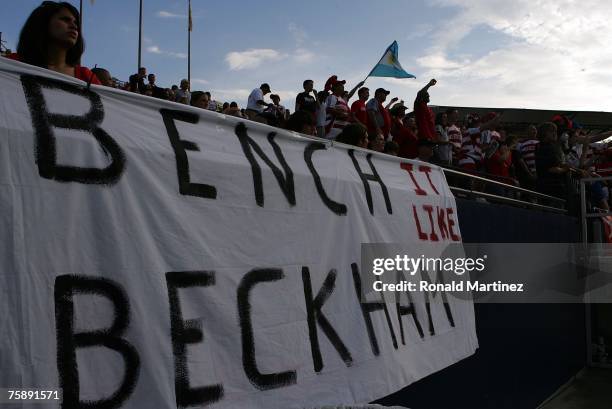 Dallas fans cheer in front of a sign that reads "Bench It Like Beckham" during SuperLiga play with the Los Angeles Galaxy July 31, 2007 at Pizza Hut...