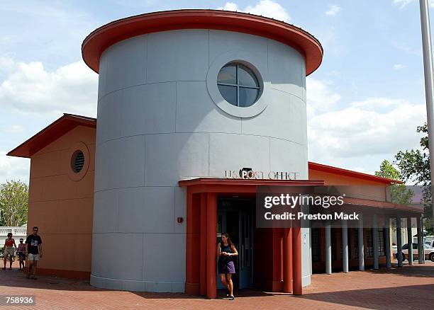 Woman leaves the post office designed by American architect Michael Graves April 9, 2002 in Celebration, FL. Mix use zoning allows constant...