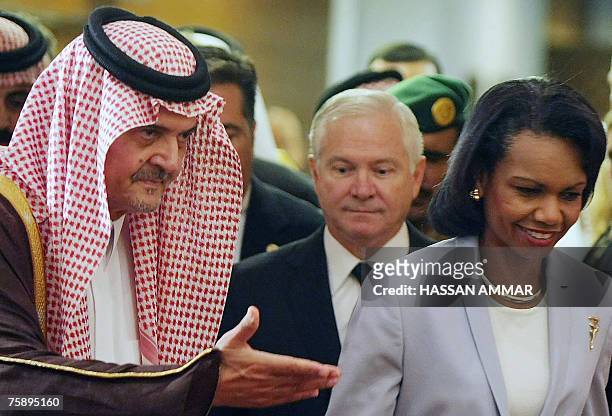 Saudi Foreign Minister Saud al Faisal shows the way to US Secretary of State Condoleezza Rice and Defence Secretary Robert Gates prior a joint press...
