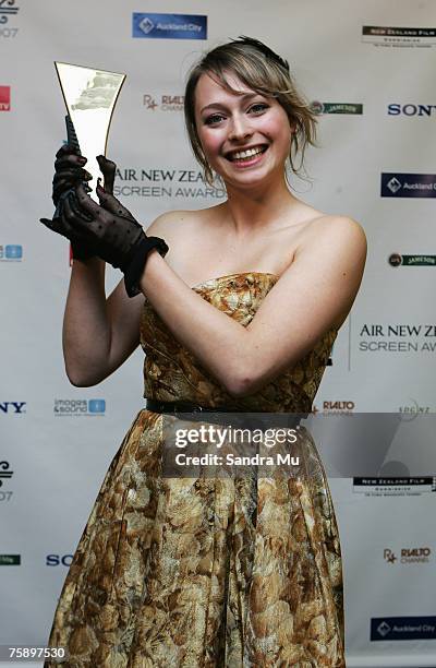 Chelisie Preston Crayford of 'Fog' with her award for best performance in a short film celebrates in the awards room at the Air New Zealand Screen...