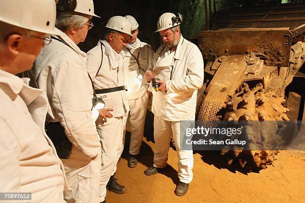 Juergen Behrens , of the German Association for the Construction and Operation of Final Storage Facilities for Waste Products, shows a drill bit to...