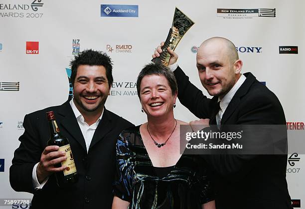 Louis Sutherland , Robyn Murphy and Mark Albiston celebrate their award for best short film in the awards room at the Air New Zealand Screen Awards...