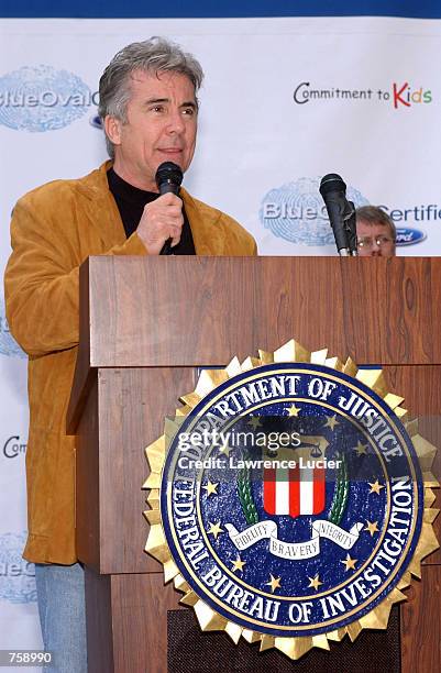 Television host John Walsh speaks at the launch of Ford Motor Company's Blue Oval Certified's 2002 Commitment to Kids program April 9, 2002 in New...