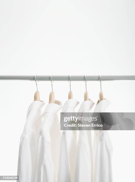 dress shirts on hangers - shirt no people stock-fotos und bilder