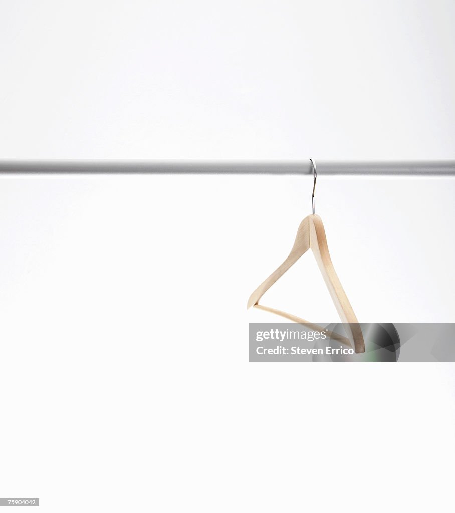 Empty hanger hanging on clothes rack