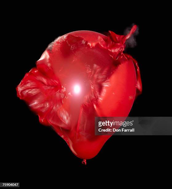 balloon bursting - red balloon stock pictures, royalty-free photos & images