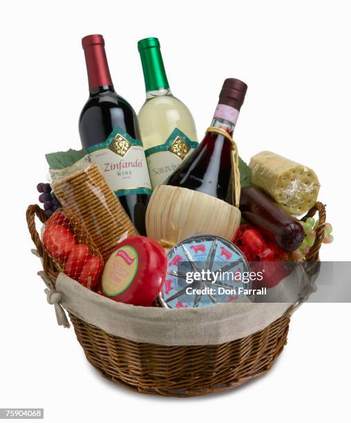 wine bottles in basket - gift hamper stock pictures, royalty-free photos & images