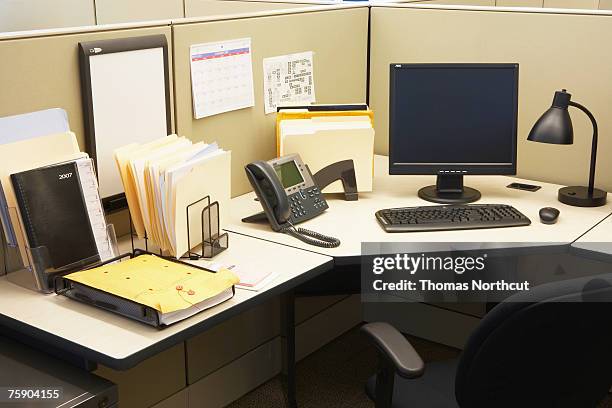 computer and landline phone in office, elevated view - neat fotografías e imágenes de stock