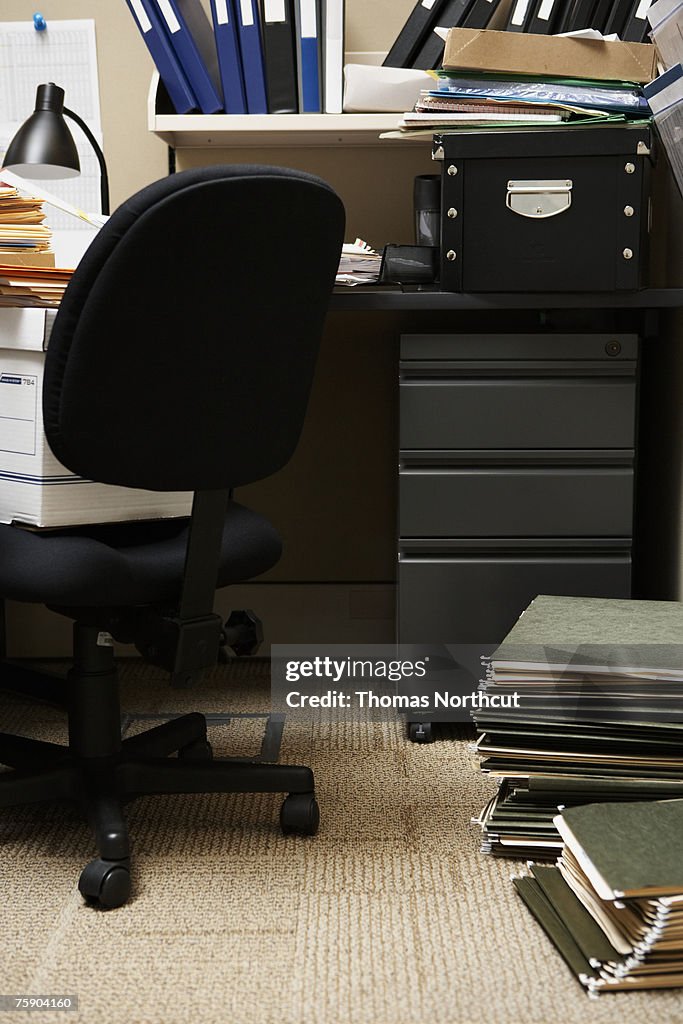 Chair and files in office