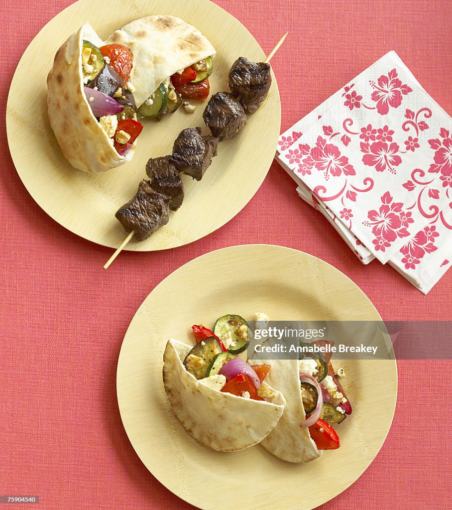 Grill-roasted vegetable pita sandwiches with grilled lamb, overhead view