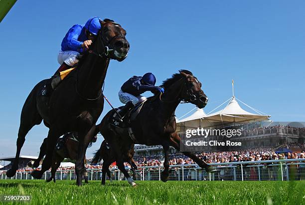 Frankie Dettori on Ramonti leads Jamie Spencer on Excellent Art to win The BGC Sussex stakes run at Goodwood Racecourse on August 1 in Goodwood,...