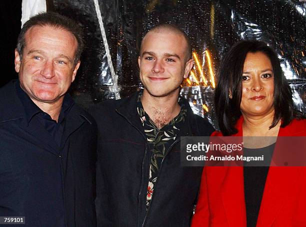 Actor Robin Williams, his son Zak, and his wife Marcia Garces arrive for the premiere of the film "Death to Smoochy" March 26, 2002 in New York City.