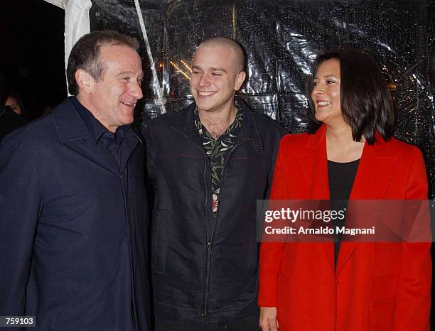 Actor Robin Williams, his son Zak, and his wife Marcia Garces arrive for the premiere of the film "Death to Smoochy" March 26, 2002 in New York City.