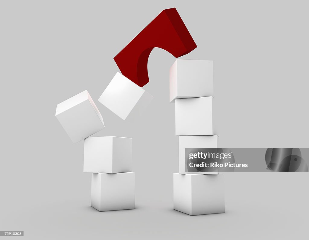 White building blocks with red arch falling