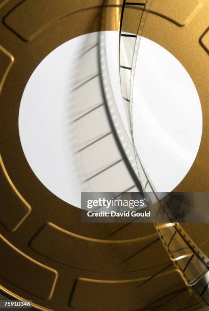 35mm movie film cans with blank label and film leader - film canister stock pictures, royalty-free photos & images