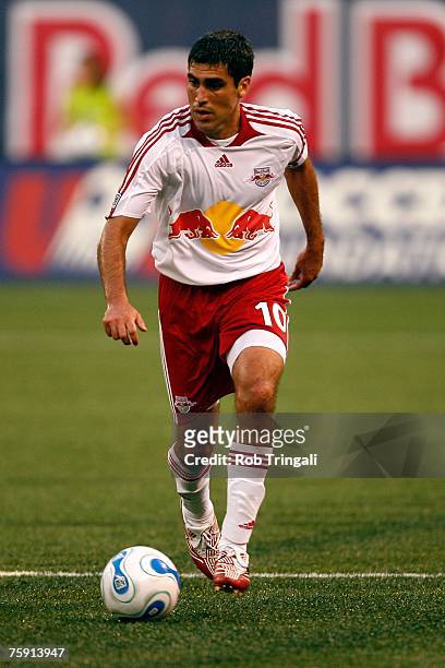 Claudio Reyna of the New York Red Bulls handles the ball against the New England Revolution on July 14, 2007 at Giants Stadium in East Rutherford,...