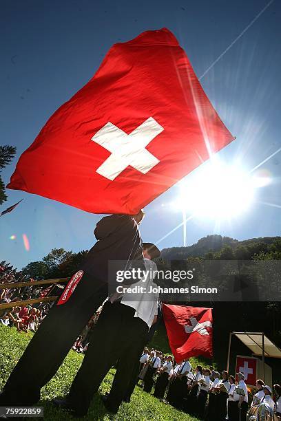 Swiss flags are seen during the Ruetli celebrations on August 1 near Luzern, Switzerland. Every year the reenactment of the forming of the Old Swiss...