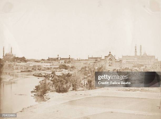 The Gomti River in Lucknow, shortly after the Indian Mutiny, 1858. The Rumi Darwaza or Turkish Gate is visible centre right, with the Bara Imambara...