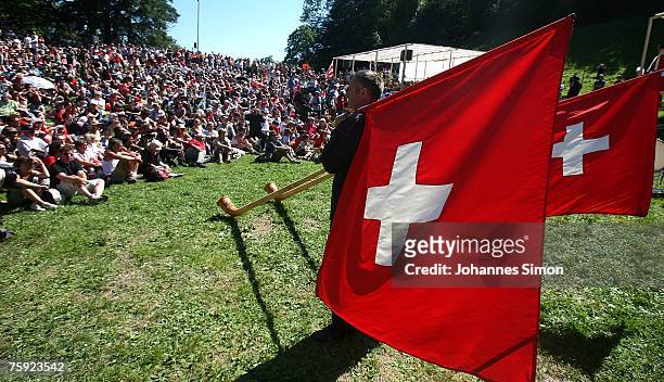 Visitors crowd the Ruetli meadow during the Ruetli celebrations on August 1 near Luzern, Switzerland. Every year the reenactment of the forming of...