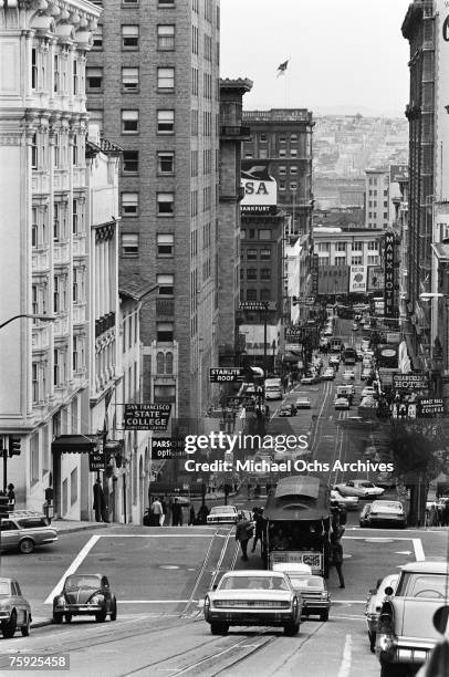 The cable cars are a noted feature of the city, even if they don't climb halfway to the stars, in early summer 1967 in San Francisco, California.