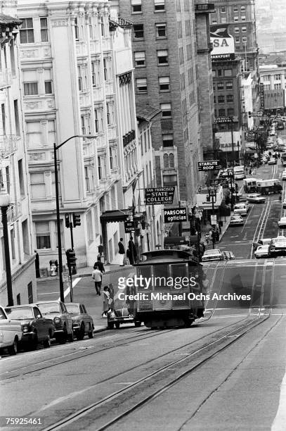 The cable cars are a noted feature of the city, even if they don't climb halfway to the stars, in early summer 1967 in San Francisco, California.