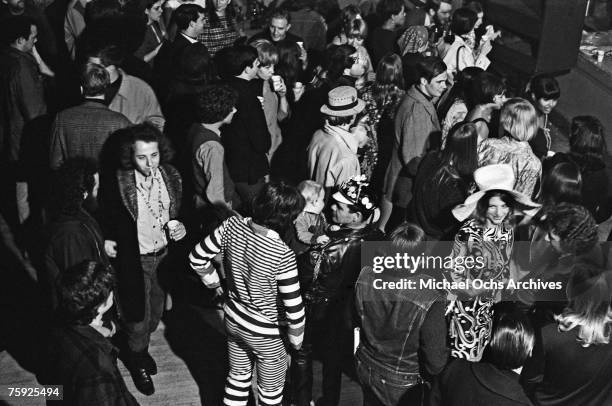 Hippies wait for a rock concert to start in early summer at the Fillmore Auditorium in San Francisco, California.