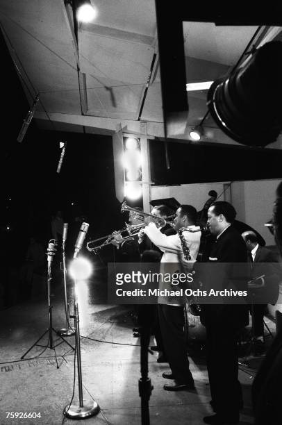 Clarinetist Pee Wee Russell, trombonist Jack Teagarden, and trumpet player Art Farmer join tenor saxophonist Lester Young at the American Jazz...