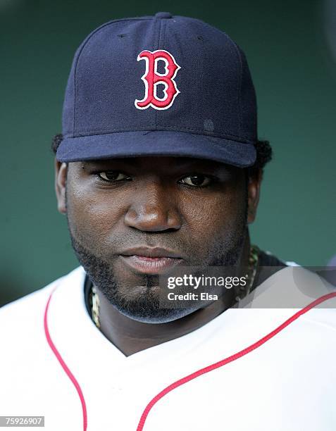 David Ortiz of the Boston Red Sox stands in the dugout before the game against the Baltimore Orioles on August 1, 2007 at Fenway Park in Boston,...