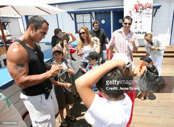 Actor Dwayne "The Rock" Johnson with fans at the Summer on the Pier benefiting "The Rock" Foundation event at the Malibu Pier on July 29, 2007 in...