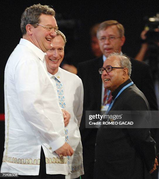 Australian Foreign Minister Alexander Downer with his Indian counterpart Shri Pranab Mukherjee and Canadian Deputy Foreign Minister Leonard Edwards...